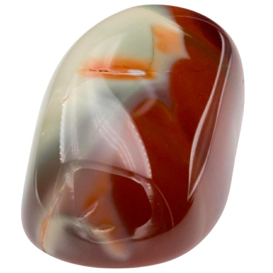 Shiny piece of Jasper in a mix of red and white color with a tinge of orange