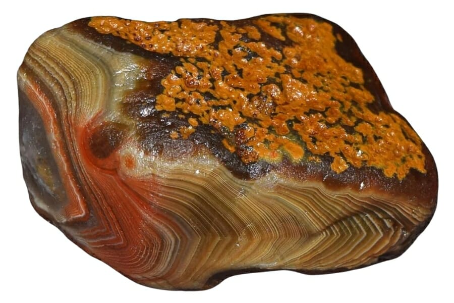 An elegant Lake Superior agate with orange spots and beautiful striped pattern
