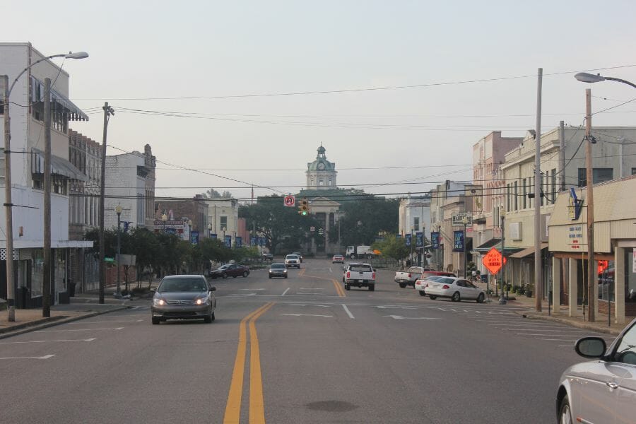 a Marion County cement road flanked by buildings