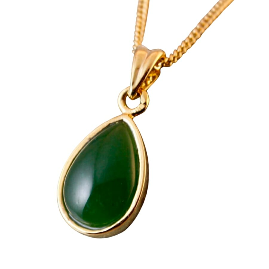 Deep-green nephrite set on a golden pendant
