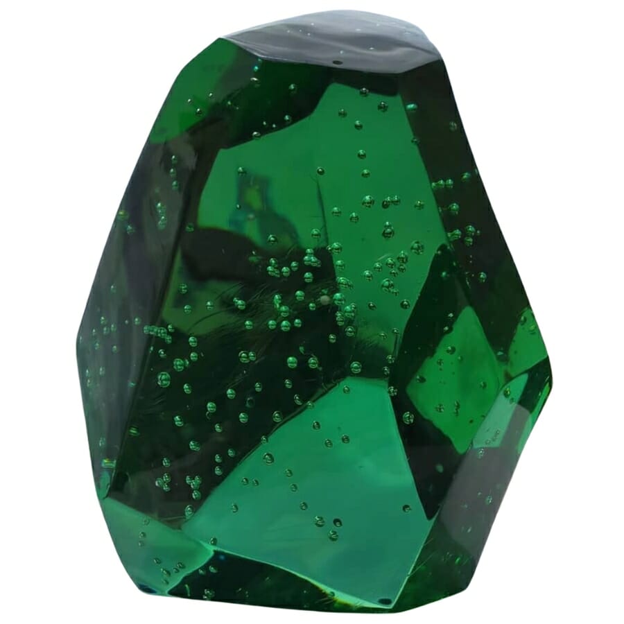 A stunning polished emerald green Andara Crystal with tiny bubbles swimming inside it