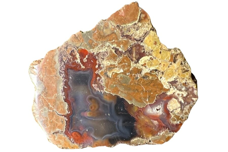 A stunning polished thunder egg with different red and orange hues