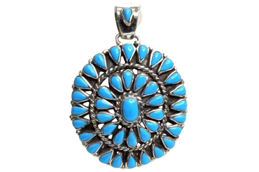 An impressive mandala-like detail of a Sleeping Beauty turquoise necklace pendant