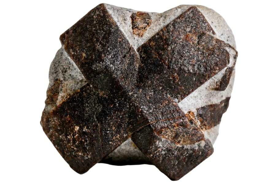Close-up look at a piece of staurolite showing a clear x-shaped brown detail