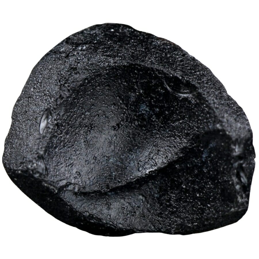 Close-up look at a shiny, black piece of tektite