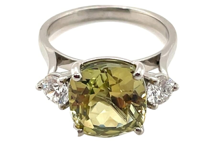 A beautiful yellow tanzanite ring with diamonds on both sides