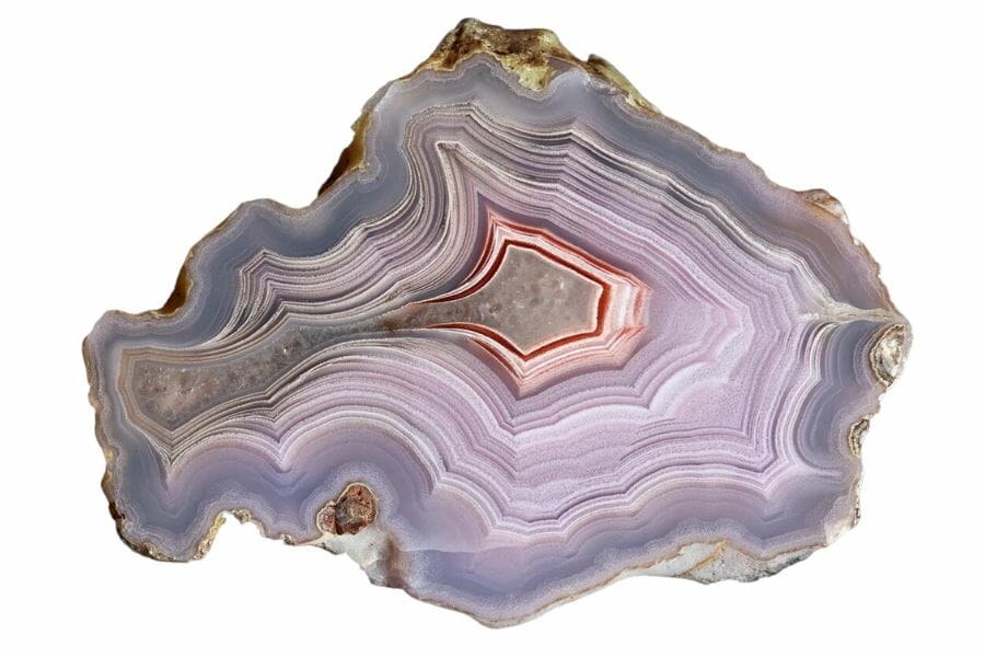 agate cross-section showing multiple red, white, gray, and purplish layers