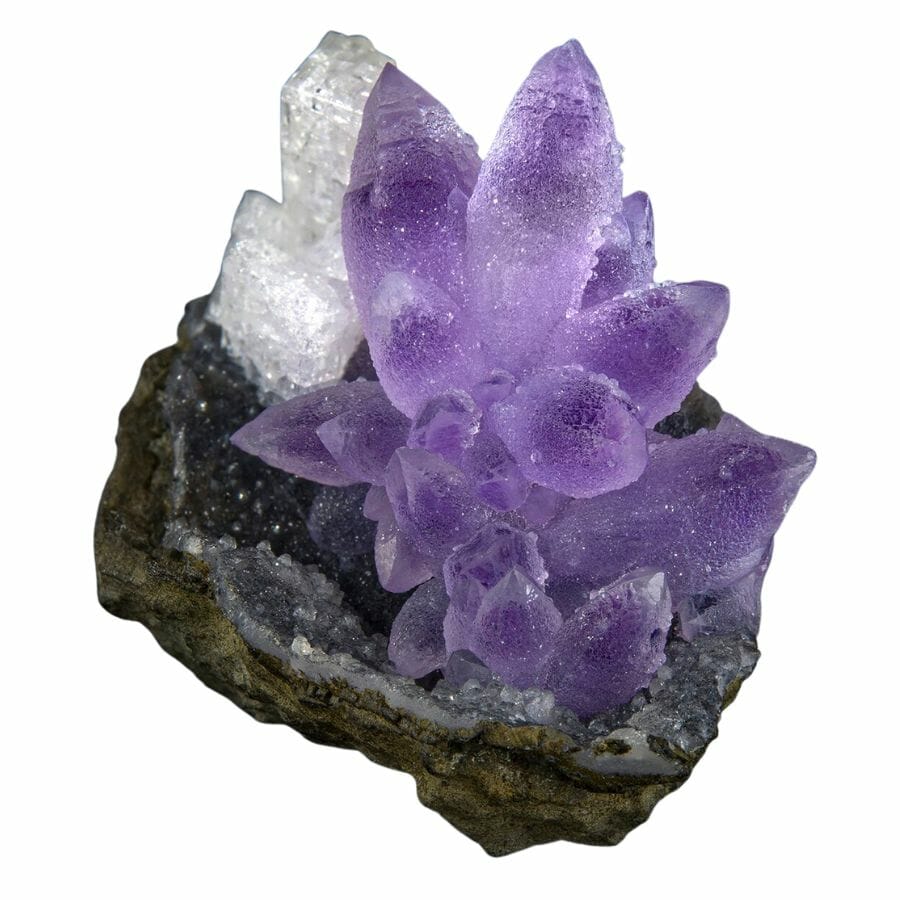 purple amethyst crystals on a rock