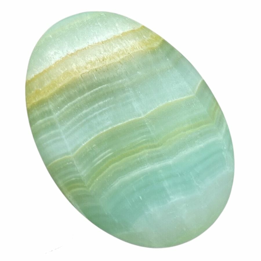 polished green calcite palm stone showing green, white, and yellow bands