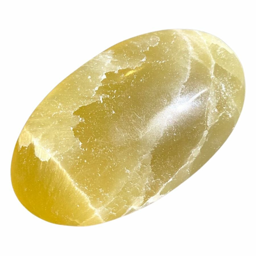 polished yellow calcite palm stone