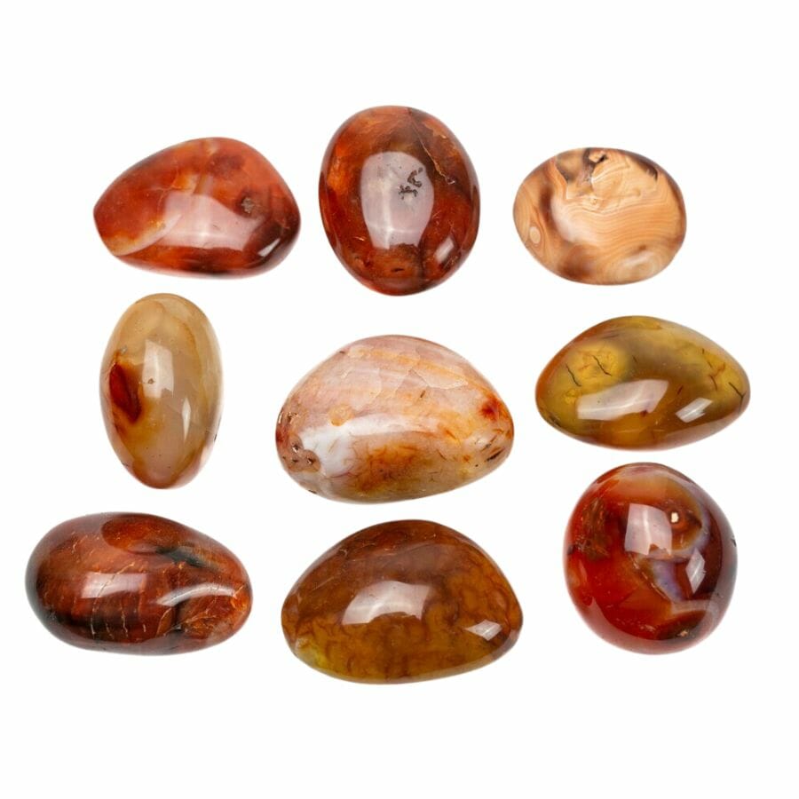 nine polished carnelian stones in red, black, and white