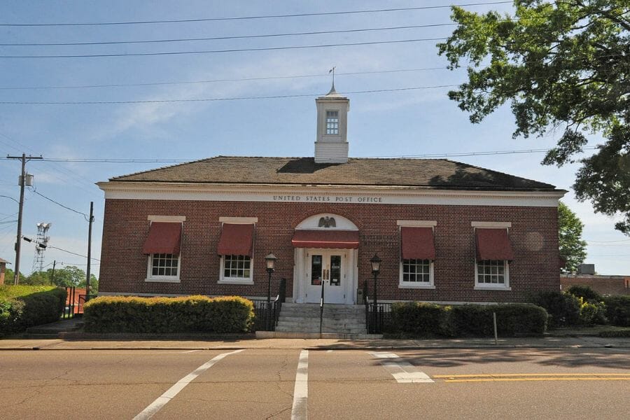 the Copiah County post office, a red brick building with a sign that says United States Post Office