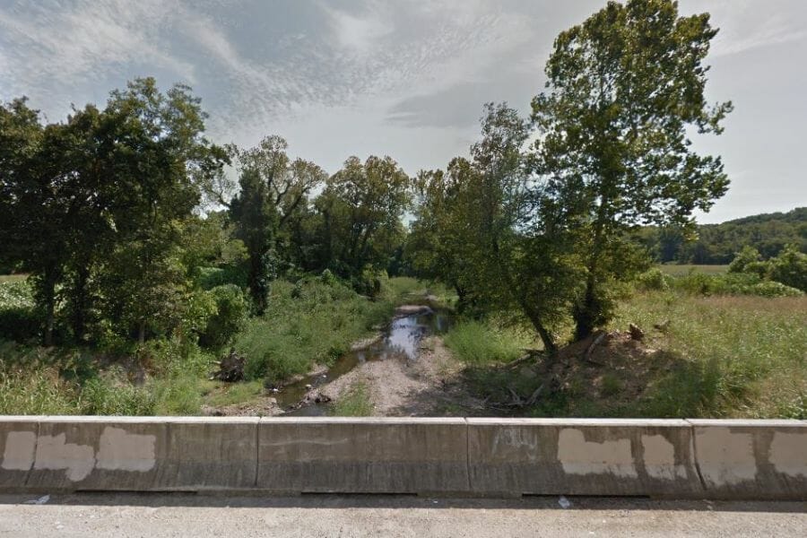 Crow Creek, Arkansas, lined by trees on both sides