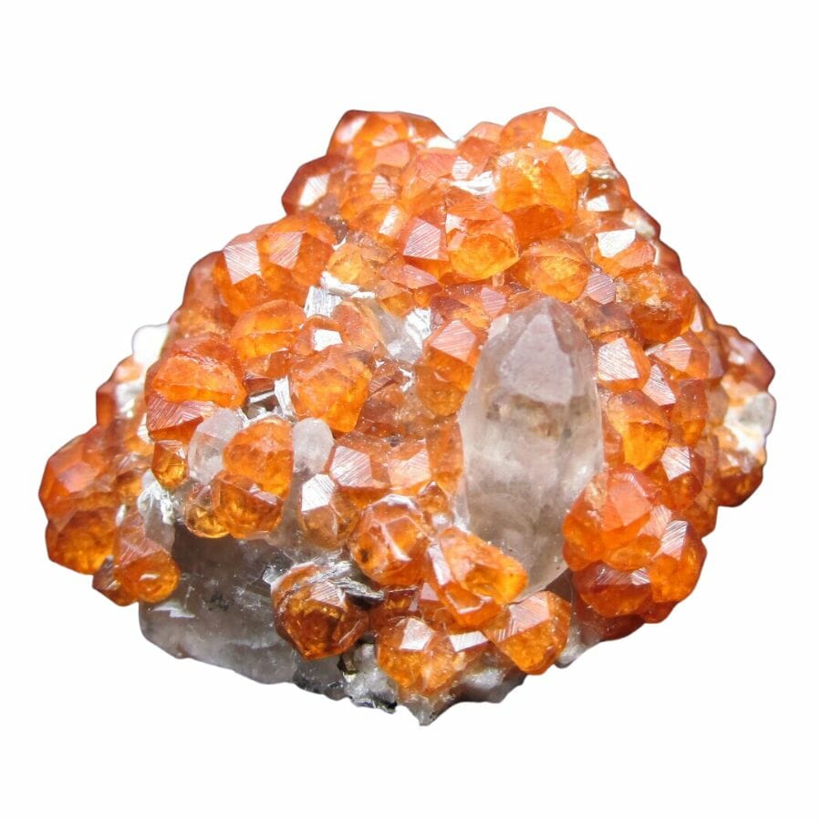 bright orange garnet crystals on a rock
