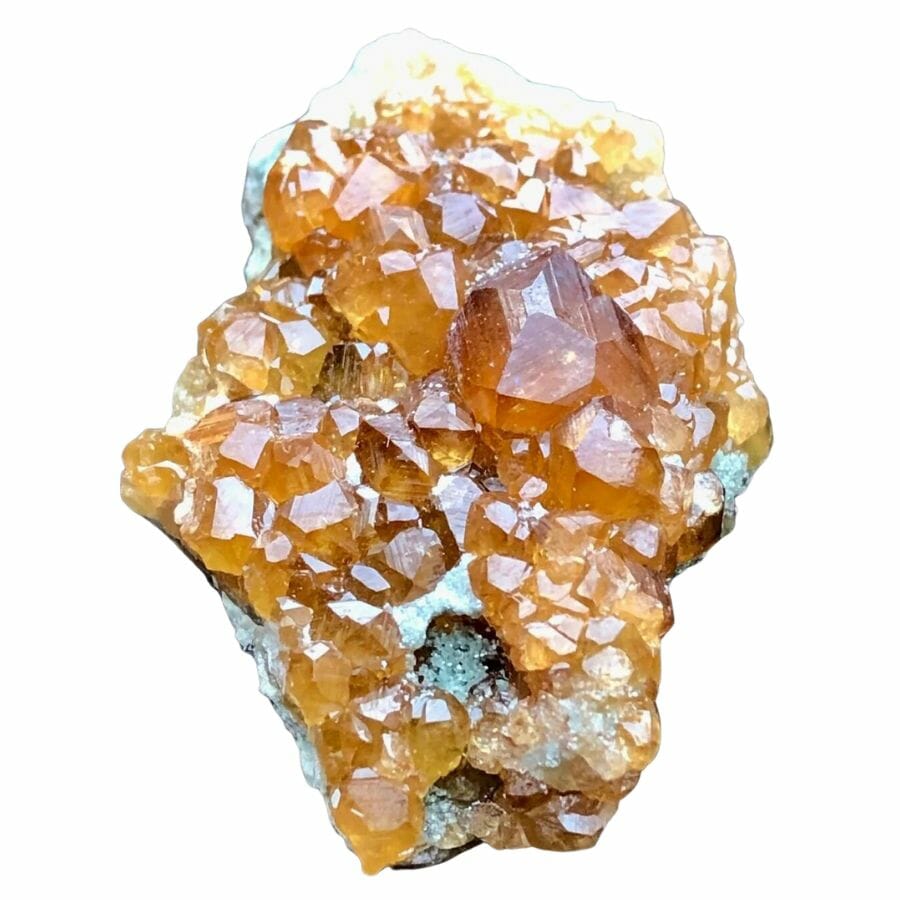 orange garnet crystals on a matrix