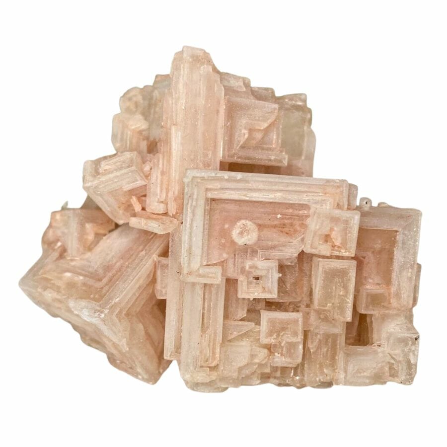 cluster of pink halite crystals displaying cubic crystal structure
