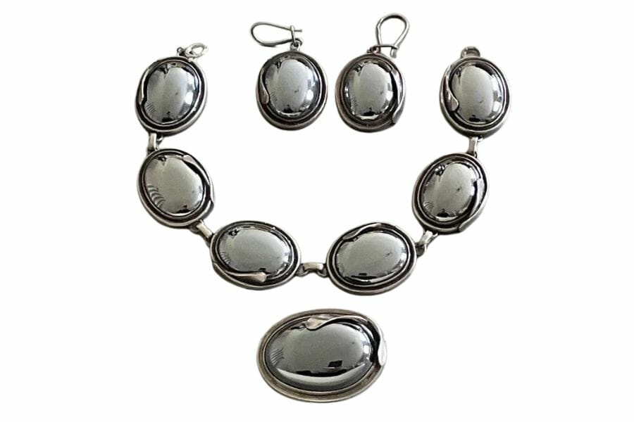metallic hematite cabochons in earrings, a pendant, and a bracelet