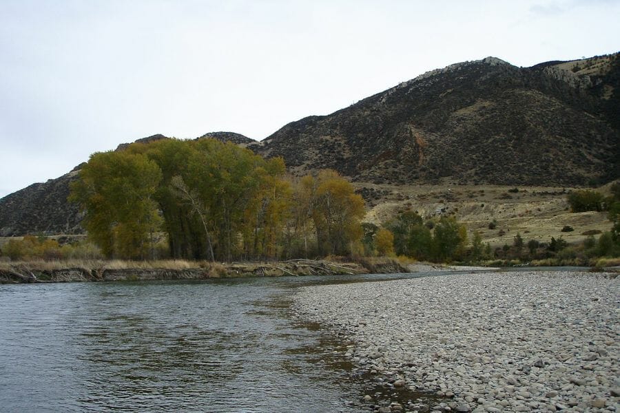 a portion of the Jefferson River with mountains in the background