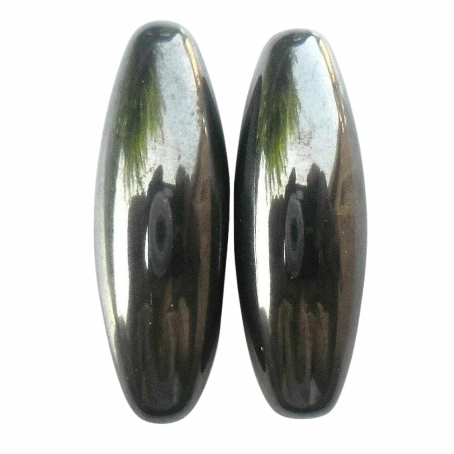 two polished metallic magnetite beads