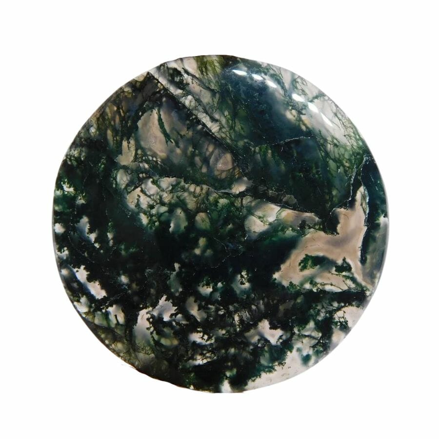 moss agate disc with translucent base and dark green mossy patterns