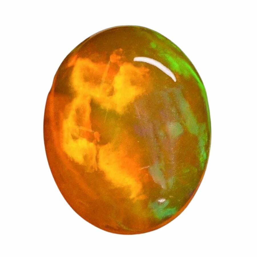 oval opal cabohon with orange, yellow, and green swirls