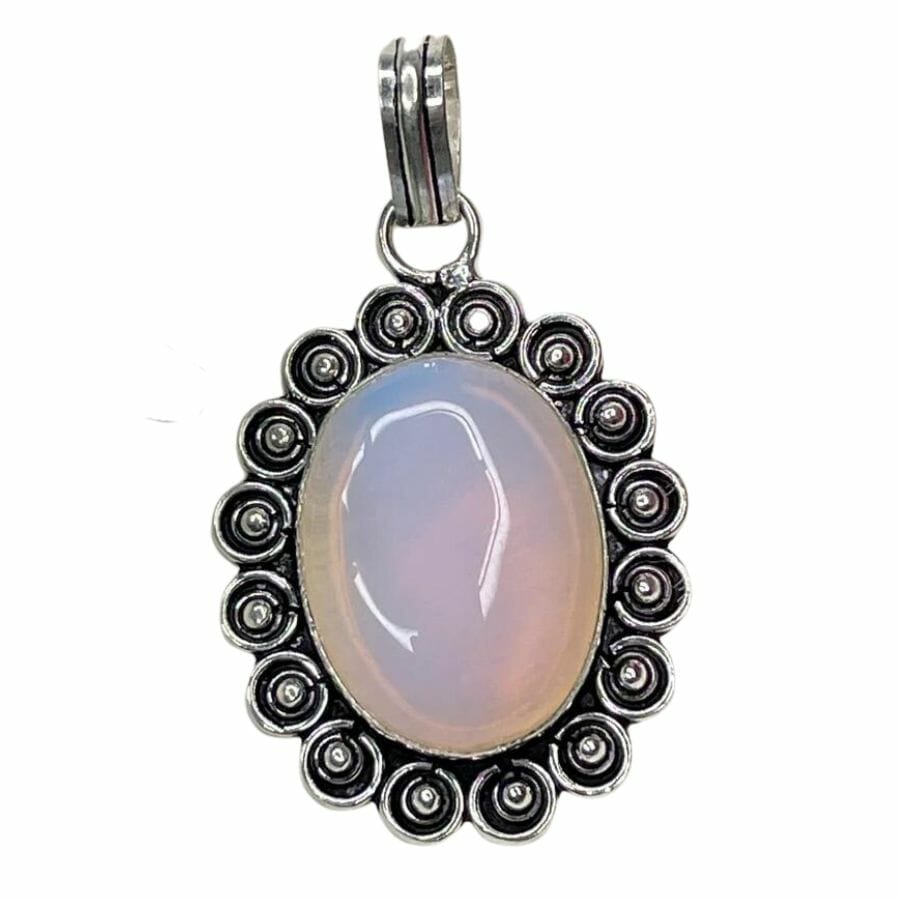 oval pink translucent opalite pendant in a silver setting