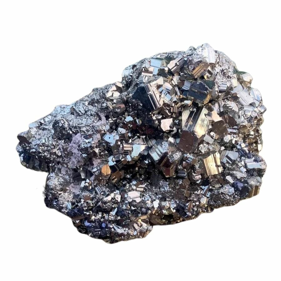 a rough piece of rock with metallic nuggets of pyrite crystals
