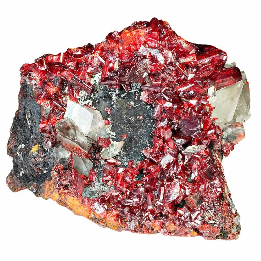 cluster of bright red realgar crystals on a piece of rock