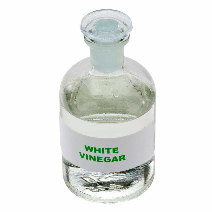 clear bottle of white vinegar with label