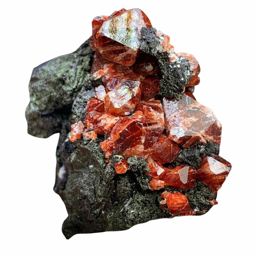cluster of bright red zircon crystals on a rock