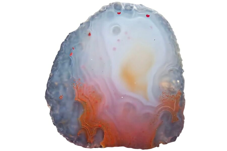 A beautiful angus coast agate with interesting patterns of orange and white 