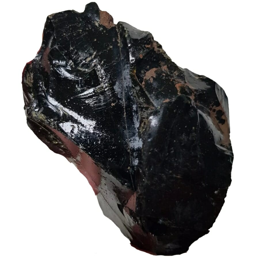 A piece of black glass that's a result of industrial smelting