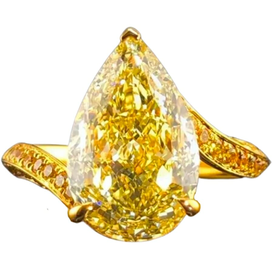 A lustrous yellow diamond set as a center stone to a gold ring