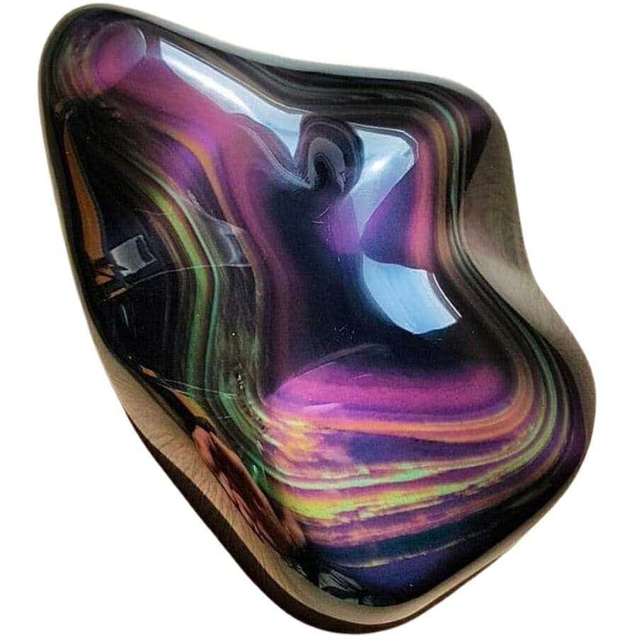 A shiny rainbow obsidian showing different colors inside