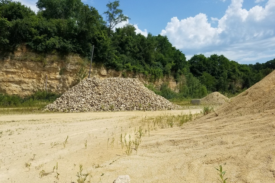 An empty quarry at Danville with lots of piles of rocks