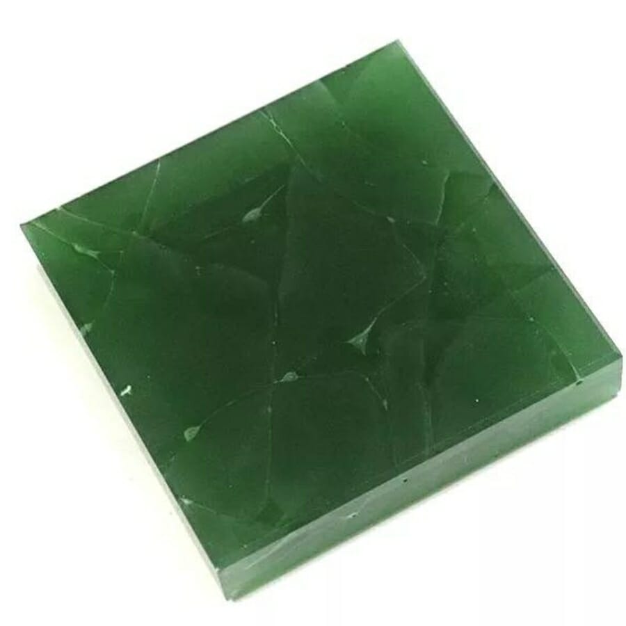 A square-cut glass jade with visible streaks or cracks