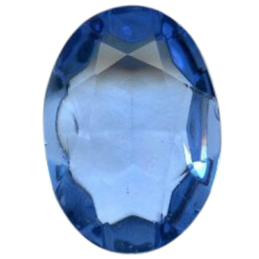 An oblong-shaped glass sapphire gemstone