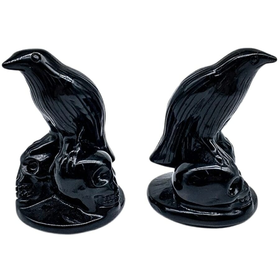 Two glassy-looking obsidian shaped as birds