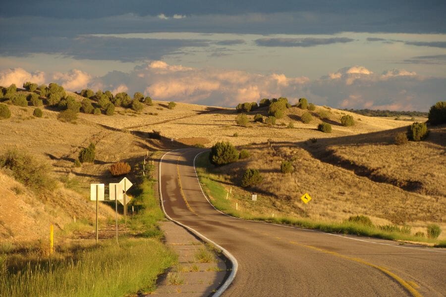 road winding between green slopes