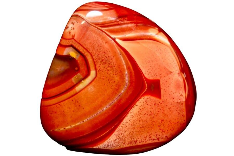 A vibrant red-orange Lake Superior Agate with bands of red and orange