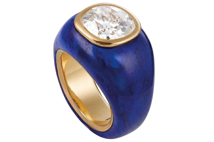 A beautiful ring with band made of deep blue lapis lazuli and white diamond as center stone