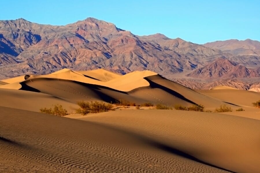 Picturesque area at the Mojave Desert with the sand dunes and mountain ranges