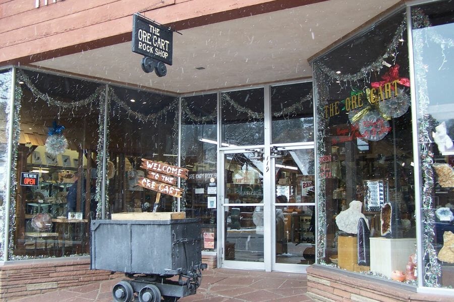 entrance to the Ore Cart Rock Shop with floor-to-ceiling glass doors and windows