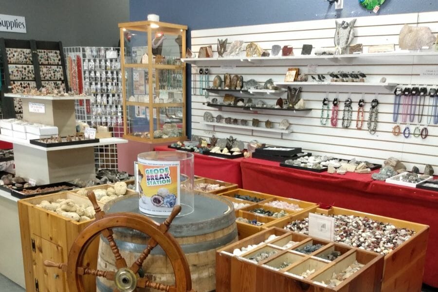 interior of a store with shelves and displays for rocks, minerals, and gems on sale
