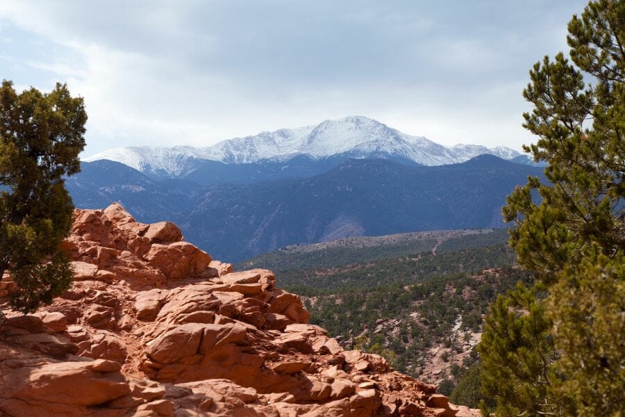 View of Pike's Peak in Colorado with a rocky slope in the foreground