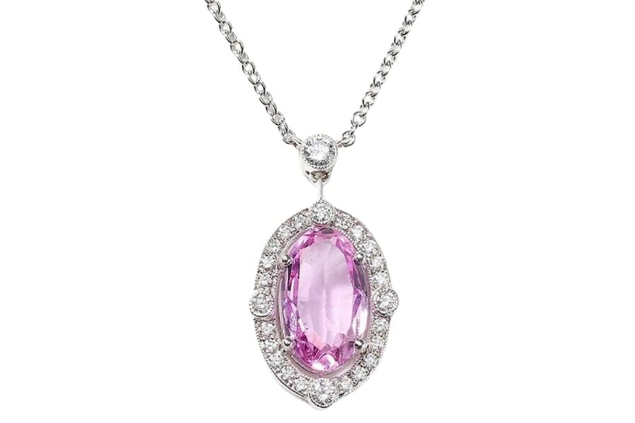 A stunning pink topaz set as a pendant to a silver necklace