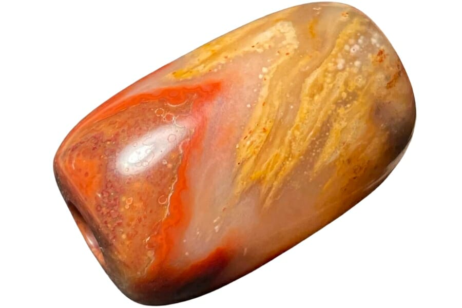 A beautiful prairie agate with swirls and patterns of orange, yellow, and brown