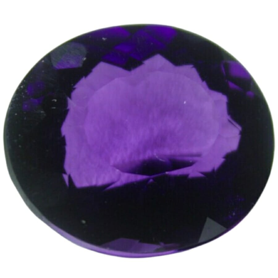 A dark purple cubic zirconia gemstone