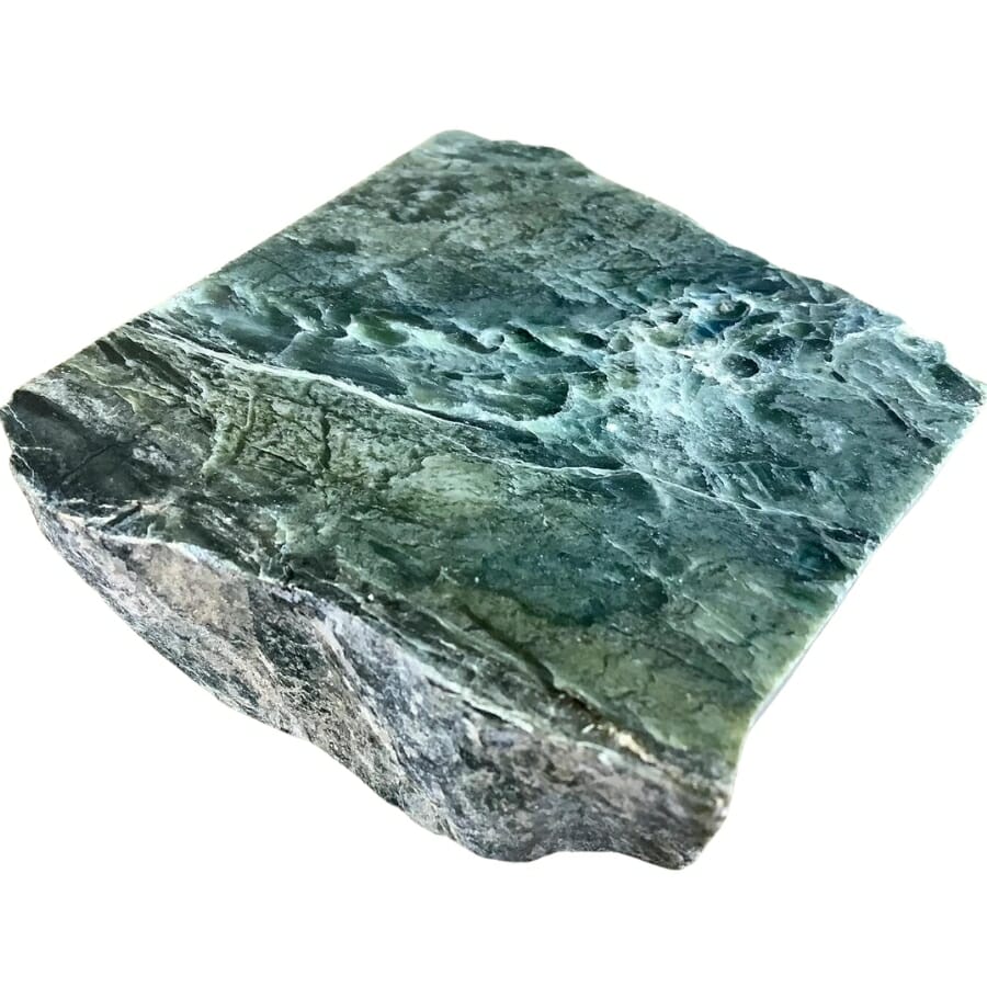 A magnificent raw jade slab which resembles a sea and the shore
