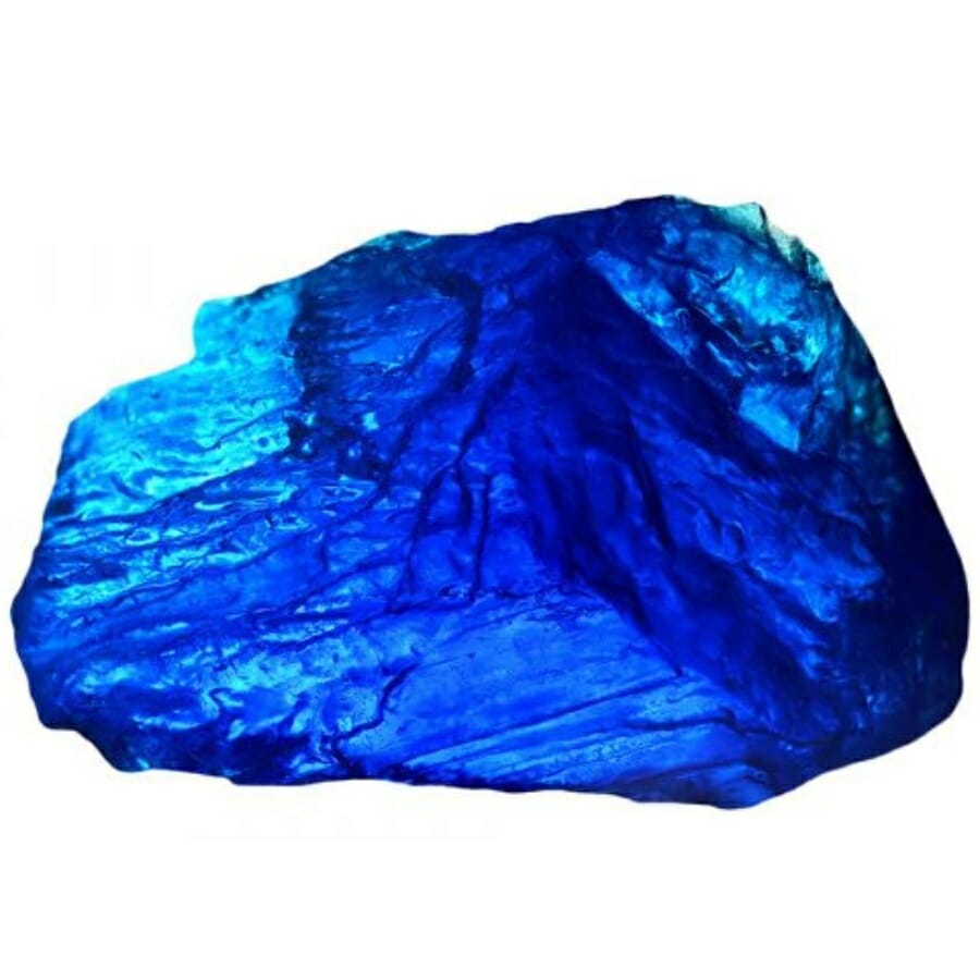 A vibrant raw chunk of blue synthetic sapphire
